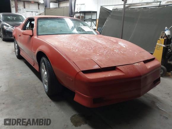 1990 Pontiac Firebird z VIN 1G2FS23T9LL219603, wystawiony jako IAAI lot #41774239 z przebiegiem 135 648 mil mil oraz . Historia ofert i sprzedaży dostępna na DreamBid. Obrazek 1.