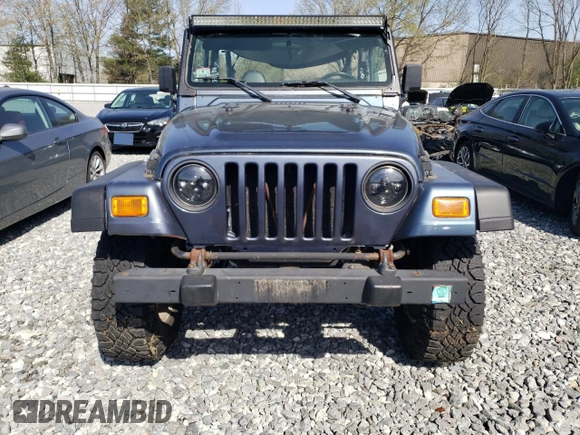 2002 Jeep Wrangler Sport with VIN 1J4FA49S92P715480, listed as a Copart auction lot 55157545 with 153,560 mi miles and Clean Title. Bid and sale history available at carsss.com. Image 6.