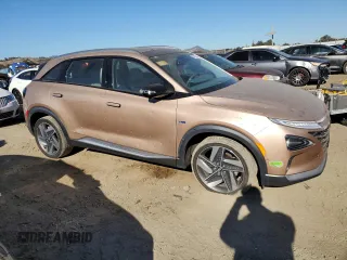 2019 Hyundai NEXO Limited z VIN KM8J84A67KU001483, wystawiony jako Copart lot #77165764 z przebiegiem 112 305 mil mil oraz Szkoda całkowita • Salvage title. Historia ofert i sprzedaży dostępna na DreamBid. Obrazek 4.