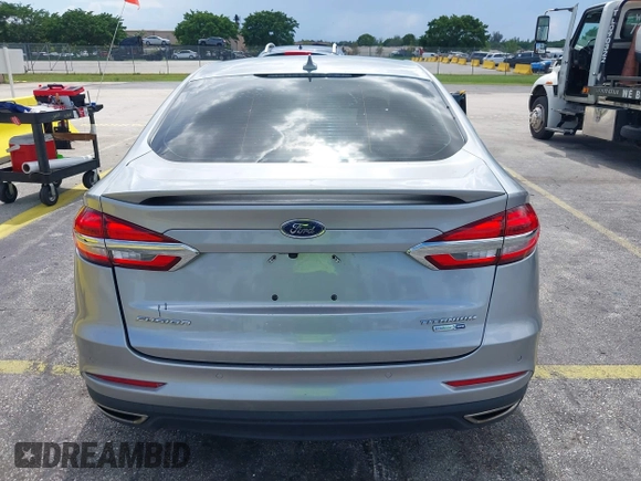 2020 Ford Fusion Titanium with VIN 3FA6P0D95LR199443, listed as a IAAI auction lot 42721371 with 77,592 mi miles and . Bid and sale history available at DreamBid. Image 16.