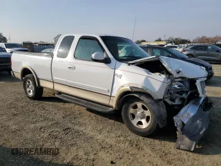1999 Ford F-150 XL with VIN 1FTRX17L2XKC10123, listed as a Copart auction lot 83158894 with 57,446 mi miles and Salvage Title. Bid and sale history available at carsss.com. Image 4.