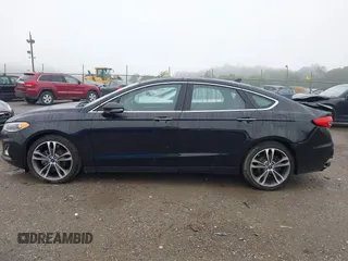2019 Ford Fusion Titanium with VIN 3FA6P0D92KR125864, listed as a IAAI auction lot 42425422 with 109,340 mi miles and . Bid and sale history available at DreamBid. Image 14.