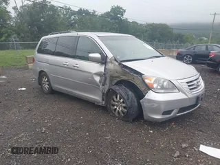 2010 Honda Odyssey EX-L z VIN 5FNRL3H79AB089023, wystawiony jako IAAI lot #42518787 z przebiegiem 235 614 mil mil oraz . Historia ofert i sprzedaży dostępna na DreamBid. Obrazek 1.
