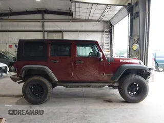 2008 Jeep Wrangler Rubicon z VIN 1J8GA69178L630840, wystawiony jako IAAI lot #42483010 z przebiegiem 145 196 mil mil oraz . Historia ofert i sprzedaży dostępna na DreamBid. Obrazek 14.
