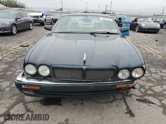 1996 Jaguar XJ with VIN SAJHX1741TC758740, listed as a Copart auction lot 73377914 with 140,964 mi miles and Salvage title. Bid and sale history available at DreamBid. Image 5.