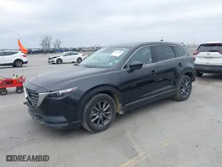 2023 Mazda CX-9 Touring with VIN JM3TCBCY3P0657538, listed as a IAAI auction lot 42024969 with 52,507 mi miles. Bid and sale history available at carsss.com. Image 2.