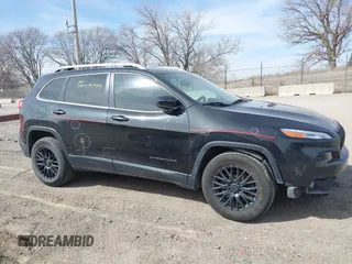 2015 Jeep Cherokee North with VIN 1C4PJMCS7FW544792, listed as a IAAI auction lot 41801573 with 140,575 mi miles. Bid and sale history available at carsss.com. Image 13.