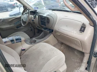 1997 Ford Expedition XLT with VIN 1FMEU1765VLB24163, listed as a IAAI auction lot 42303093 with 137,427 mi miles and . Bid and sale history available at DreamBid. Image 5.