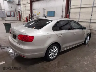 2014 Volkswagen Jetta Sedan SE with VIN 3VWD17AJ9EM241667, listed as a IAAI auction lot 41657090 with 114,641 mi miles. Bid and sale history available at carsss.com. Image 4.