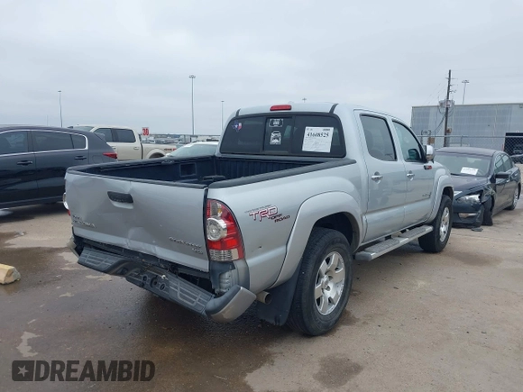 2009 Toyota Tacoma PreRunner with VIN 3TMJU62NX9M081748, listed as a IAAI auction lot 41608525 with 210,999 mi miles. Bid and sale history available at carsss.com. Image 4.