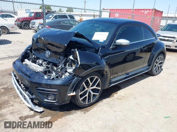 2018 Volkswagen Beetle Dune with VIN 3VWSD7AT1JM702354, listed as a IAAI auction lot 41993527 with 50,952 mi miles and . Bid and sale history available at DreamBid. Image 2.