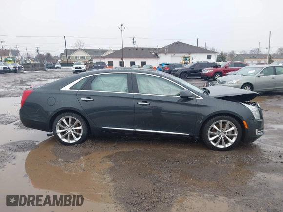 2013 Cadillac XTS Luxury z VIN 2G61R5S35D9100771, wystawiony jako IAAI lot #41673766 z przebiegiem 41 123 mil mil oraz . Historia ofert i sprzedaży dostępna na DreamBid. Obrazek 13.