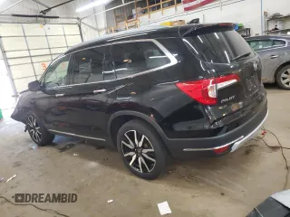 2019 Honda Pilot Touring 7-Passenger with VIN 5FNYF6H65KB092806, listed as a Copart auction lot 54205085 with 130,219 mi miles and Salvage title. Bid and sale history available at DreamBid. Image 2.