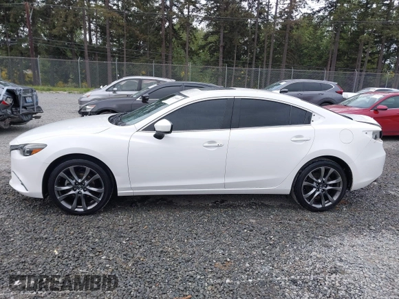 2017 Mazda 6 Grand Touring with VIN JM1GL1X51H1142473, listed as a IAAI auction lot 42234809 with 101,633 mi miles and . Bid and sale history available at DreamBid. Image 15.