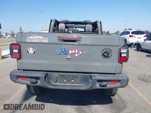 2021 Jeep Gladiator 80th Anniversary z VIN 1C6HJTAG7ML564981, wystawiony jako IAAI lot #42455062 z przebiegiem 89 721 mil mil oraz . Historia ofert i sprzedaży dostępna na DreamBid. Obrazek 16.
