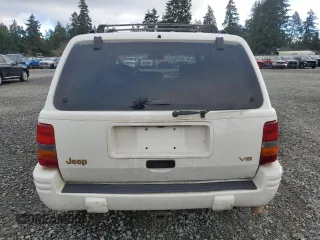 1997 Jeep Grand Cherokee Limited with VIN 1J4GZ78Y7VC772292, listed as a Copart auction lot 87692445 with 0 mi miles and Salvage Title. Bid and sale history available at carsss.com. Image 6.