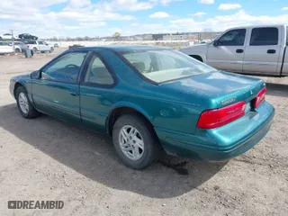 1997 Ford Thunderbird LX with VIN 1FALP62W7VH153454, listed as a IAAI auction lot 41833472 with 147,269 mi miles. Bid and sale history available at carsss.com. Image 3.