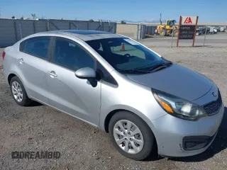 2015 Kia Rio LX with VIN KNADM4A39F6459522, listed as a IAAI auction lot 41970324 with 148,351 mi miles. Bid and sale history available at carsss.com. Image 1.