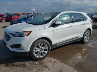 2020 Ford Edge Titanium z VIN 2FMPK3K98LBA42159, wystawiony jako IAAI lot #42358229 z przebiegiem 88 512 mil mil oraz . Historia ofert i sprzedaży dostępna na DreamBid. Obrazek 2.