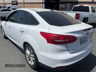 2018 Ford Focus SE z VIN 1FADP3F20JL259181, wystawiony jako IAAI lot #42400276 z przebiegiem 161 473 mil mil oraz . Historia ofert i sprzedaży dostępna na DreamBid. Obrazek 1.