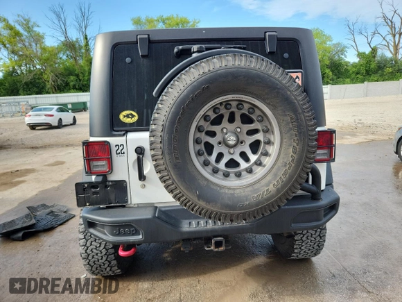 2015 Jeep Wrangler Unlimited Rubicon with VIN 1C4BJWFGXFL518301, listed as a Copart auction lot 61910775 with 153,945 mi miles and Clean title. Bid and sale history available at DreamBid. Image 6.