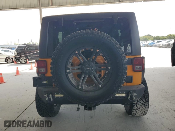 2013 Jeep Wrangler Unlimited Sport z VIN 1C4BJWDGXDL556580, wystawiony jako Copart lot #55477185 z przebiegiem 71 044 mil mil oraz Szkoda całkowita • Salvage title. Historia ofert i sprzedaży dostępna na DreamBid. Obrazek 6.