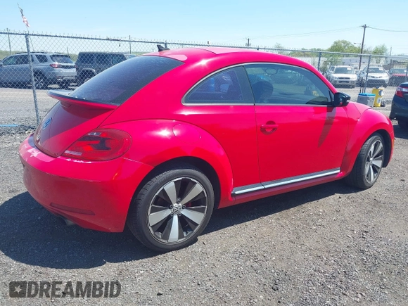 2012 Volkswagen Beetle 2.0T Turbo w/Sun/Snd/Nav PZEV with VIN 3VWVA7AT4CM608798, listed as a IAAI auction lot 42130353 with 152,052 mi miles. Bid and sale history available at carsss.com. Image 4.