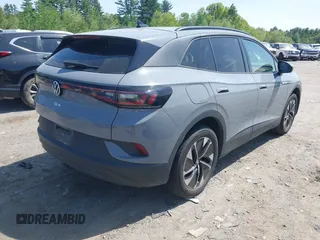 2022 Volkswagen ID.4 Pro S z VIN WVGGNPE24NP059968, wystawiony jako IAAI lot #42210089 z przebiegiem 36 860 mil mil oraz . Historia ofert i sprzedaży dostępna na DreamBid. Obrazek 4.