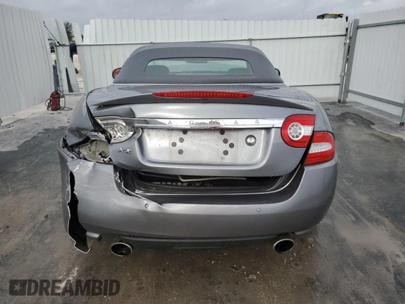 2010 Jaguar XK with VIN SAJWA4GB4ALB37114, listed as a Copart auction lot 77673824 with 99,999 mi miles and Salvage Title. Bid and sale history available at carsss.com. Image 6.
