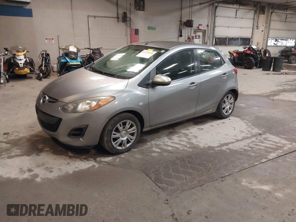2012 Mazda 2 Sport with VIN JM1DE1KZ0C0149808, listed as a IAAI auction lot 42233078 with 166,111 mi miles and . Bid and sale history available at DreamBid. Image 2.