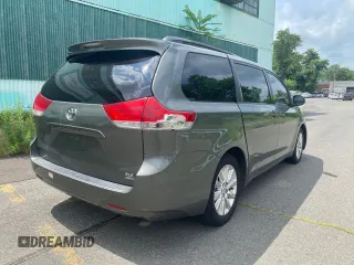2011 Toyota Sienna XLE with VIN 5TDDK3DC3BS023855, listed as a Copart auction lot 65672825 with 280,540 mi miles and Clean title. Bid and sale history available at DreamBid. Image 4.