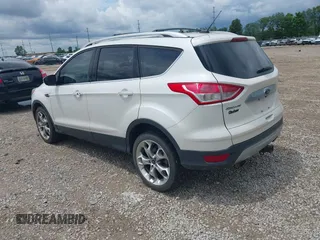 2016 Ford Escape Titanium z VIN 1FMCU9J90GUC76504, wystawiony jako IAAI lot #42552851 z przebiegiem 89 570 mil mil oraz . Historia ofert i sprzedaży dostępna na DreamBid. Obrazek 3.