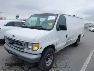 1999 Ford Econoline Cargo with VIN 1FTNS24L4XHB26129, listed as a IAAI auction lot 42187130 with 339,289 mi miles and . Bid and sale history available at DreamBid. Image 2.