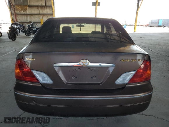 2000 Toyota Avalon XL z VIN 4T1BF28B3YU045264, wystawiony jako Copart lot #57519185 z przebiegiem 157 113 mil mil oraz Szkoda całkowita • Salvage title. Historia ofert i sprzedaży dostępna na DreamBid. Obrazek 6.