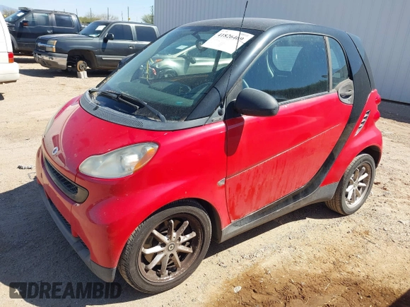 2009 Smart fortwo Pure z VIN WMEEJ31X59K291372, wystawiony jako IAAI lot #41826469 z przebiegiem 87 773 mil mil oraz . Historia ofert i sprzedaży dostępna na DreamBid. Obrazek 2.
