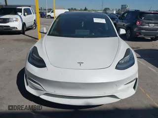 2020 Tesla Model 3 Standard Range Plus with VIN 5YJ3E1EA1LF659765, listed as a IAAI auction lot 41834411 with 42,433 mi miles and . Bid and sale history available at carsss.com. Image 12.
