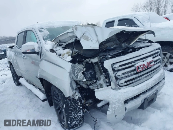 2015 GMC Canyon 4WD SLT with VIN 1GTG6CE36F1257975, listed as a IAAI auction lot 41607688 with 127,523 mi miles. Bid and sale history available at carsss.com. Image 1.