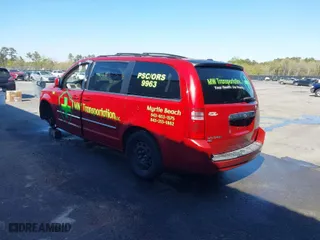2009 Dodge Grand Caravan SXT with VIN 2D8HN54X99R524373, listed as a IAAI auction lot 41886225 with 124,590 mi miles. Bid and sale history available at carsss.com. Image 3.