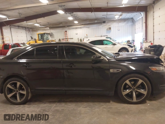 2015 Ford Taurus SEL with VIN 1FAHP2H80FG133240, listed as a IAAI auction lot 41897873 with 189,059 mi miles. Bid and sale history available at carsss.com. Image 13.