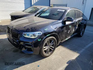 2020 BMW X4 M40i with VIN 5UX2V5C04L9D60103, listed as a Copart auction lot 72379394 with 32,575 mi miles and Salvage Title. Bid and sale history available at carsss.com. Image 1.