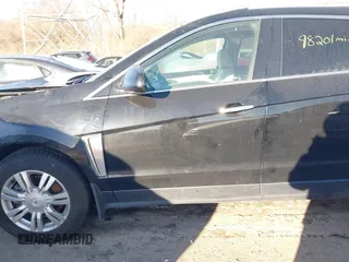 2016 Cadillac SRX Luxury Collection z VIN 3GYFNBE38GS585949, wystawiony jako IAAI lot #41413583 z przebiegiem 98 201 mil mil oraz . Historia ofert i sprzedaży dostępna na DreamBid. Obrazek 14.