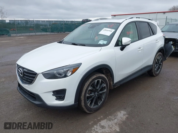 2016 Mazda CX-5 Grand Touring z VIN JM3KE4DY0G0705884, wystawiony jako IAAI lot #42016910 z przebiegiem 73 324 mil mil oraz . Historia ofert i sprzedaży dostępna na DreamBid. Obrazek 17.