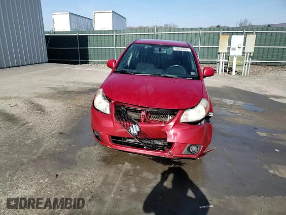 2012 Suzuki SX4 LE z VIN JS2YC5A34C6300969, wystawiony jako Copart lot #49036095 z przebiegiem 163 367 mil mil oraz Szkoda całkowita • Salvage title. Historia ofert i sprzedaży dostępna na DreamBid. Obrazek 13.