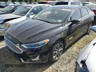 2019 Ford Fusion Hybrid Titanium with VIN 3FA6P0RU3KR140063, listed as a Copart auction lot 50548475 with 144,829 mi miles and Salvage Title. Bid and sale history available at carsss.com. Image 1.