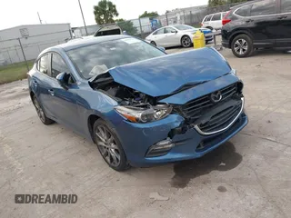 2018 Mazda 3 Touring z VIN 3MZBN1V33JM214656, wystawiony jako IAAI lot #38240123 z przebiegiem Nie podano mil oraz . Historia ofert i sprzedaży dostępna na DreamBid. Obrazek 1.