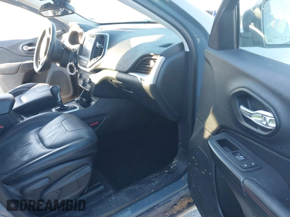 2015 Jeep Cherokee Trailhawk with VIN 1C4PJMBSXFW614416, listed as a IAAI auction lot 41033241 with 112,015 mi miles. Bid and sale history available at carsss.com. Image 5.