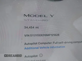 2021 Tesla Model Y Standard Range with VIN 5YJYGDED9MF121828, listed as a IAAI auction lot 42119518 with 34,454 mi miles and . Bid and sale history available at carsss.com. Image 14.