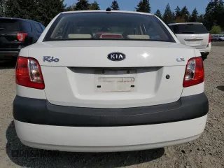 2009 Kia Rio LX with VIN KNADE223896456292, listed as a Copart auction lot 54990605 with 61,220 mi miles and Salvage Title. Bid and sale history available at DreamBid. Image 6.