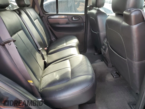 2006 GMC Envoy SLE z VIN 1GKDS13S062176000, wystawiony jako Copart lot #57672995 z przebiegiem 161 455 mil mil oraz Szkoda całkowita • Salvage title. Historia ofert i sprzedaży dostępna na DreamBid. Obrazek 11.