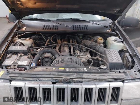 1995 Jeep Grand Cherokee Laredo with VIN 1J4GZ58S6SC765863, listed as a IAAI auction lot 41797726 with 234,715 mi miles and . Bid and sale history available at DreamBid. Image 10.